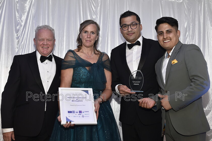 DAL6252 
 Peterborough Community Business Awards at the Marriott Hotel. Best Hospitality winners Gurkha Dubaar and runner-up Deeping Caravan Park with sponsor Mike Greene.