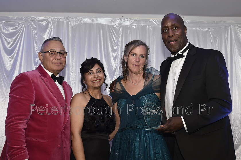 DAL6225 
 Peterborough Community Business Awards at the Marriott Hotel. Best local sports team - winner Clifton Findley with Gez and Rosie Chetal